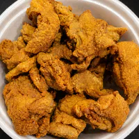 Frango Americano 400g (Coxa e Sobrecoxa Desossada Empanada)